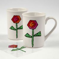 Mugs with a transferred marker-drawn Design from transparent Foil