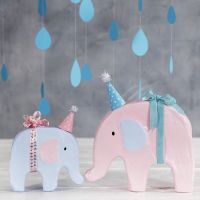 An Elephant decorated with Craft Paint and a small Party Hat