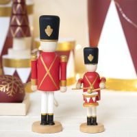A wooden Nutcracker decorated with Plus Color