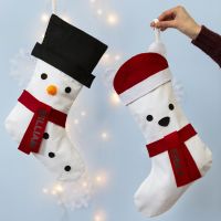 A Christmas Stocking decorated as a Snowman and a Polar Bear
