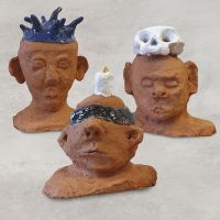 Busts from red earth clay