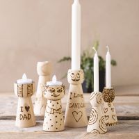 Wooden candle holders with burnt patterns