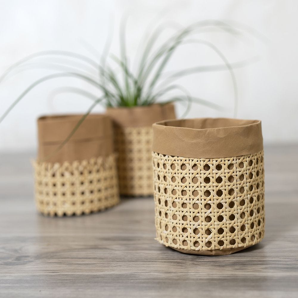 A storage bag from faux leather paper decorated with rattan